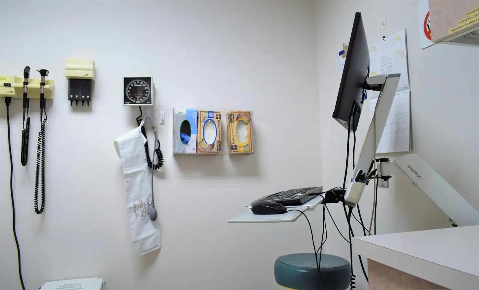 A clinician reviewing results with an older adult patient in an exam room