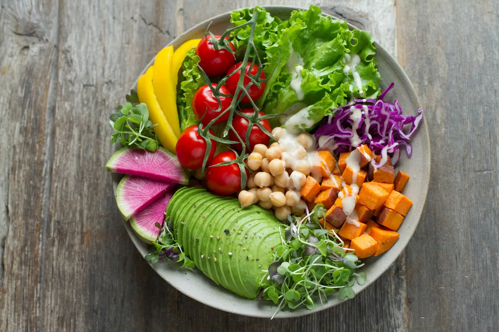 Bowl of fresh colorful vegetables on a kitchen table